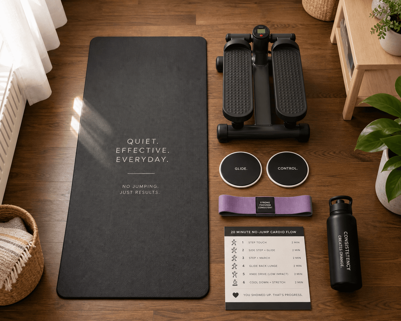 Top-down flat lay of quiet home cardio equipment on hardwood floor: small round slider discs, a resistance band loop, and a compact mini stepper, arranged neatly next to a yoga mat.