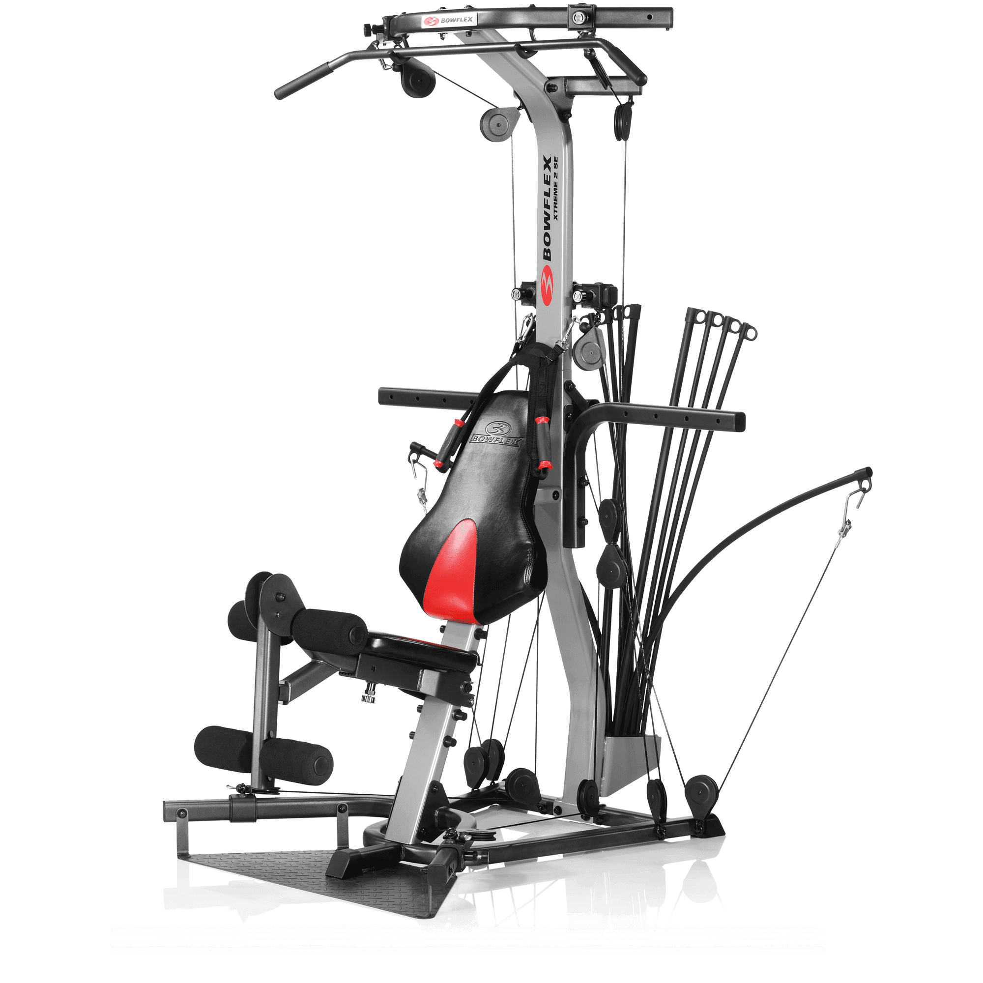 The Bowflex Xtreme 2 SE home gym machine shown on a white background with pulleys, Power Rod arms, bench, and leg extension.