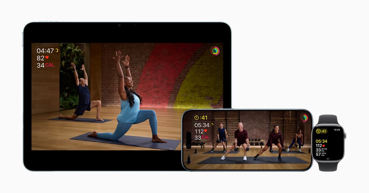 An Apple Watch wearer exercising with Apple Fitness+ displayed on an iPhone screen, showing real-time workout metrics including heart rate, time, and Activity rings against a dark background.