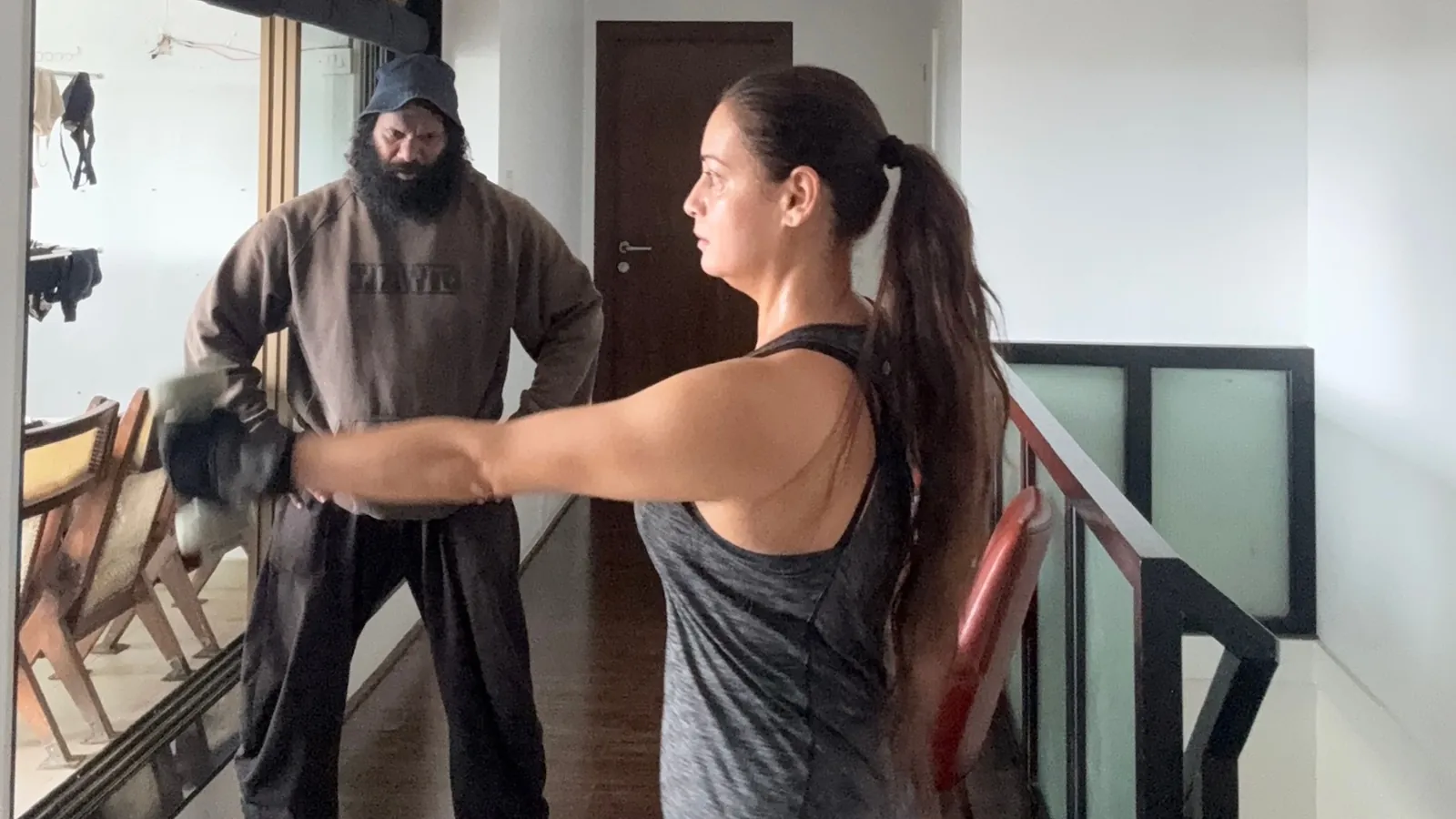 Dia Mirza exercising with trainer Kunal Vijay More in a bright indoor training space