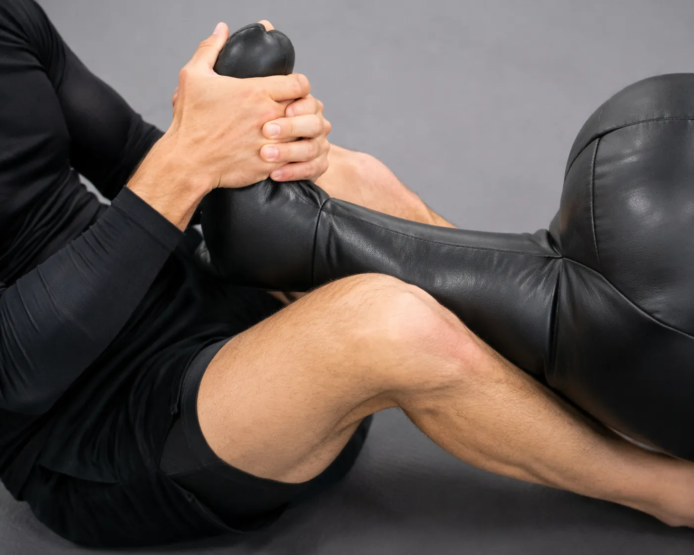 Close-up of two-on-one foot control and deep shin wedge placement for a calf slicer