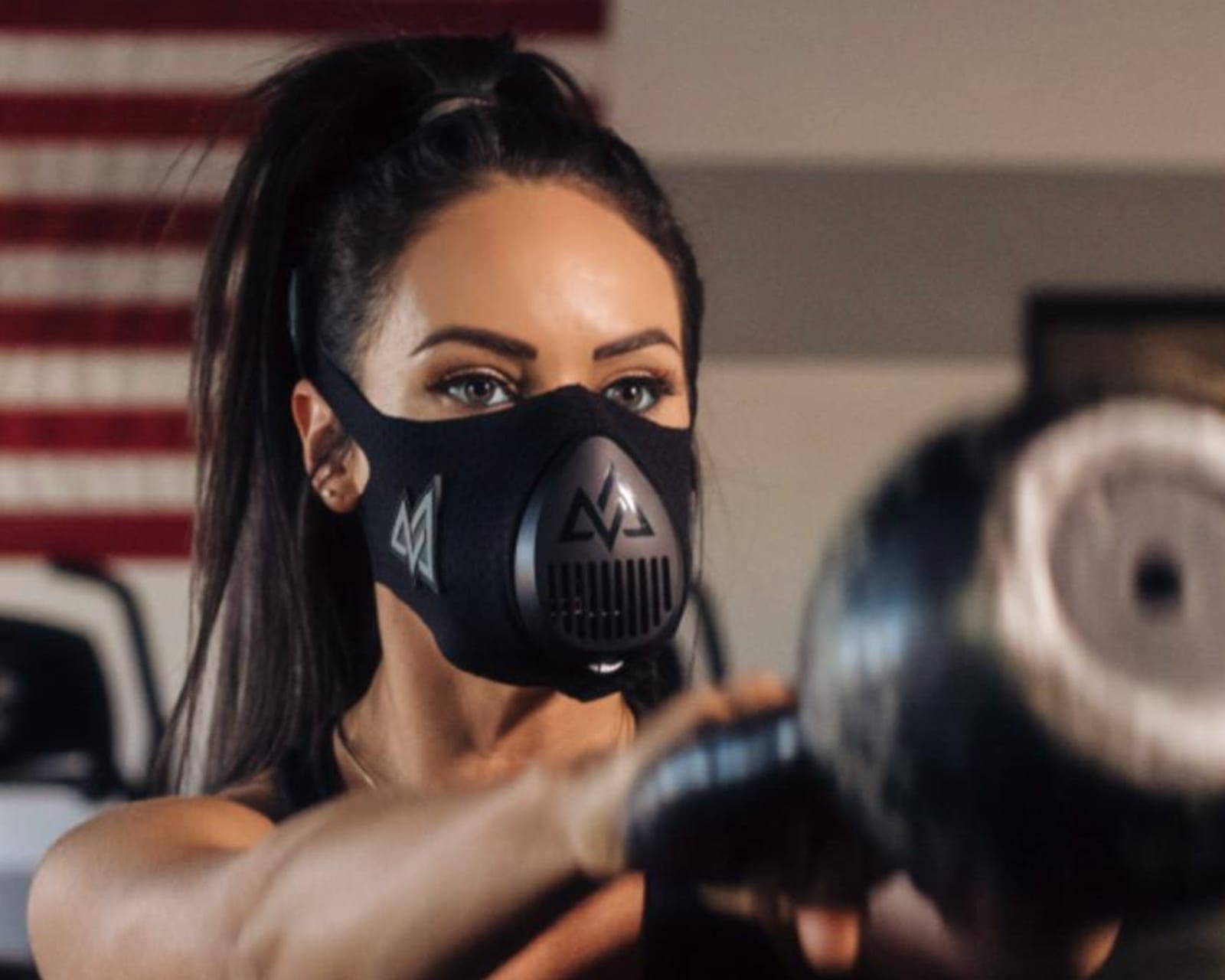 Black elevation training mask with adjustable straps and air-resistance valves