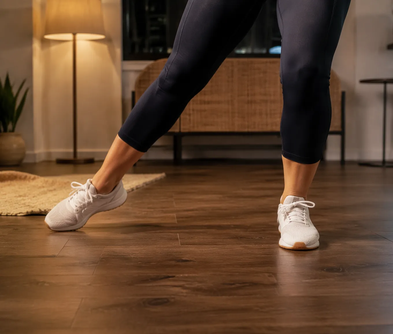 Close-up of cha-cha chassé footwork on a hardwood apartment floor