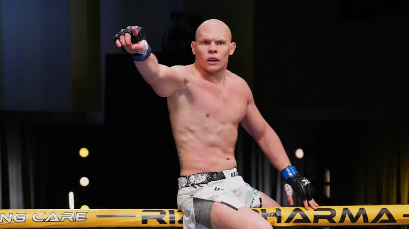 Bogdan Guskov throwing a strike inside the UFC octagon during an official fight