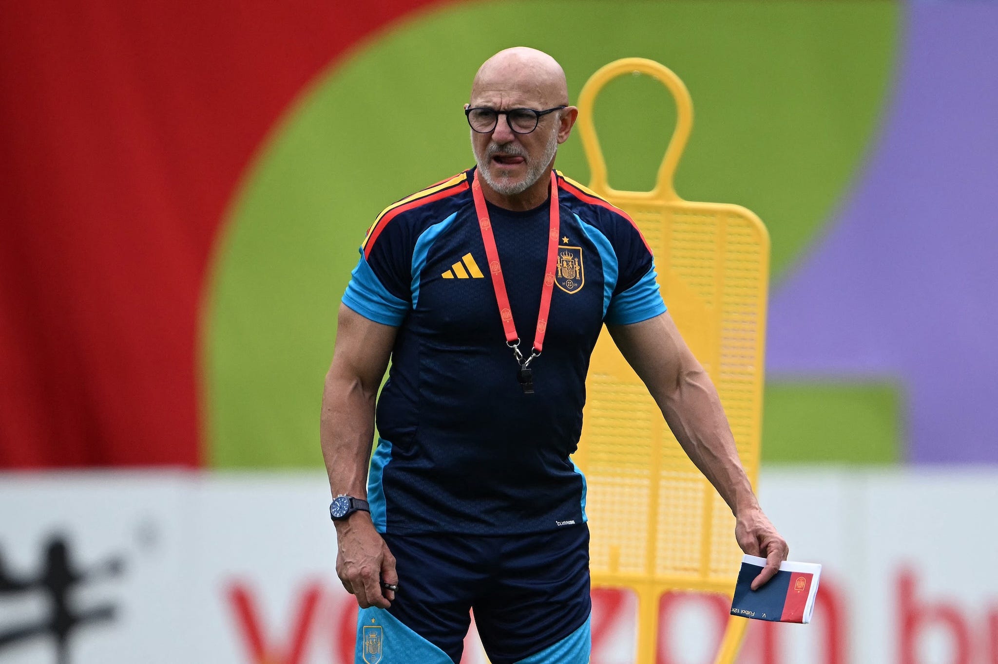 Luis de la Fuente standing indoors in a polo shirt with visibly developed arms