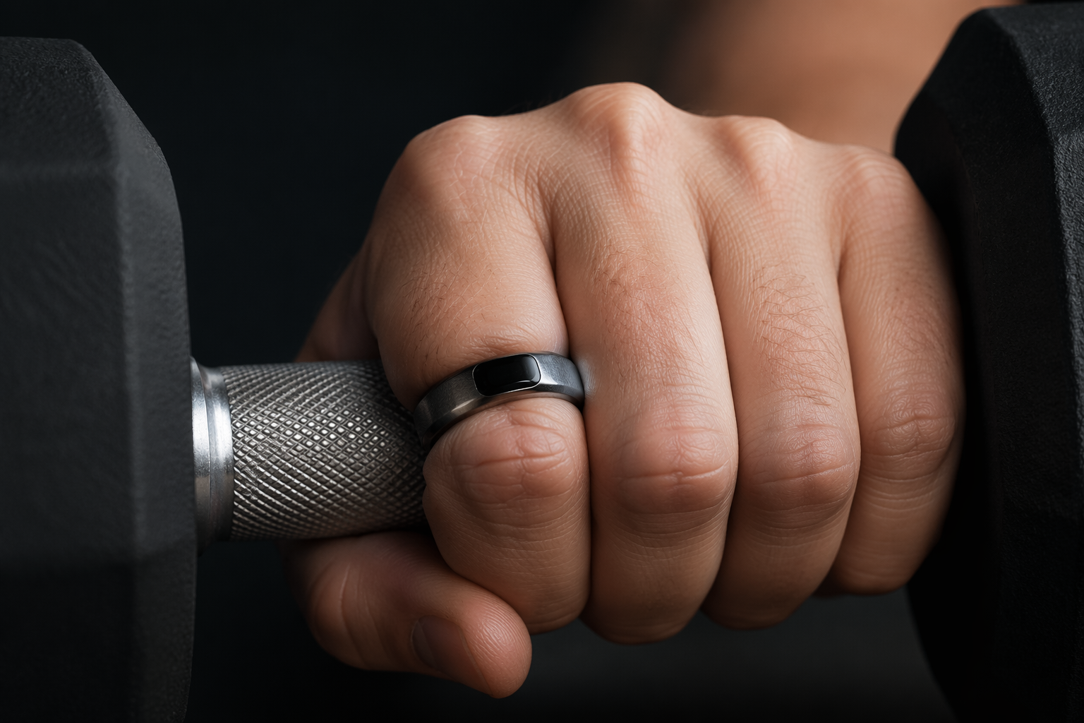 Smart ring pressed against a dumbbell handle during weight training