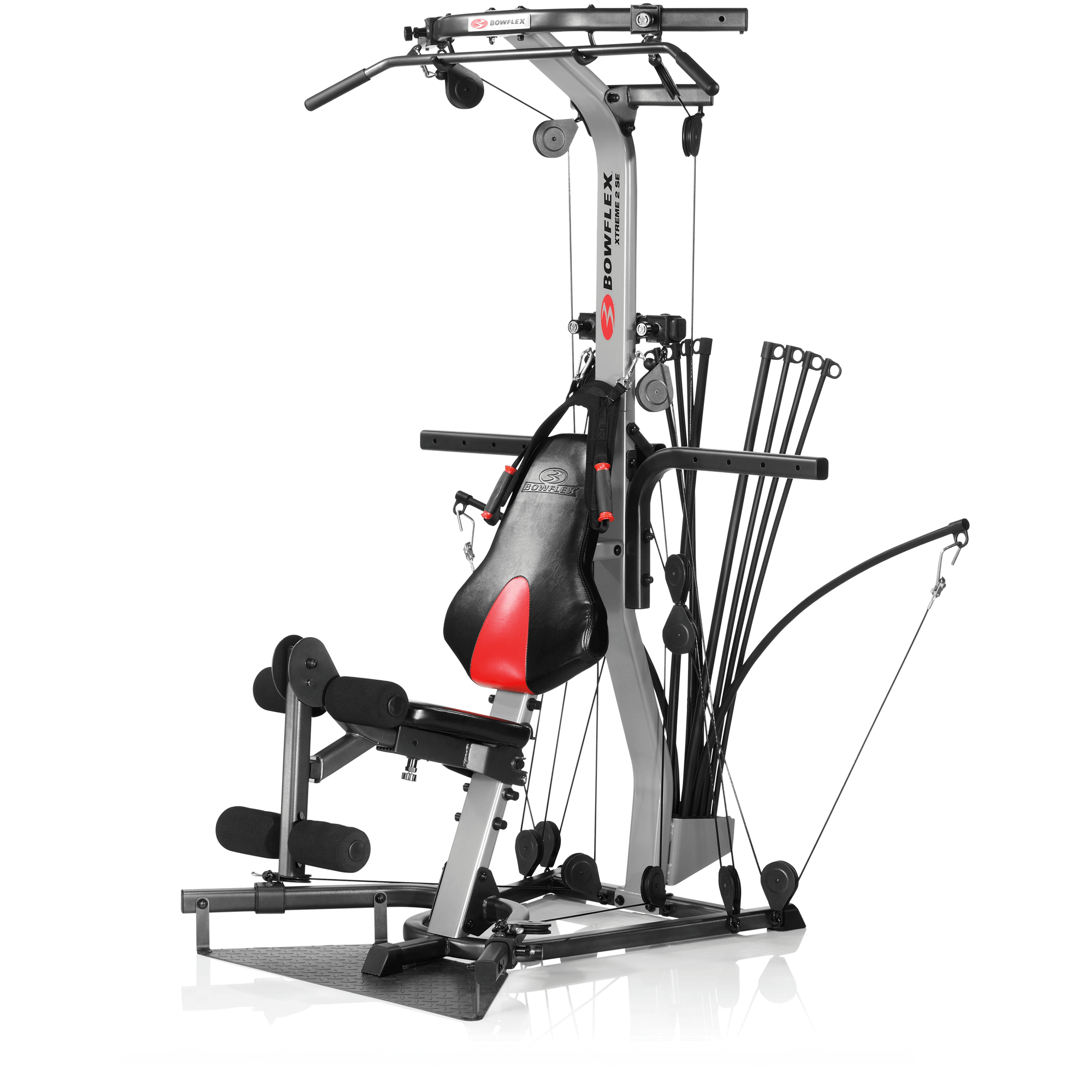 The Bowflex Xtreme 2 SE home gym machine shown on a white background with pulleys, Power Rod arms, bench, and leg extension.