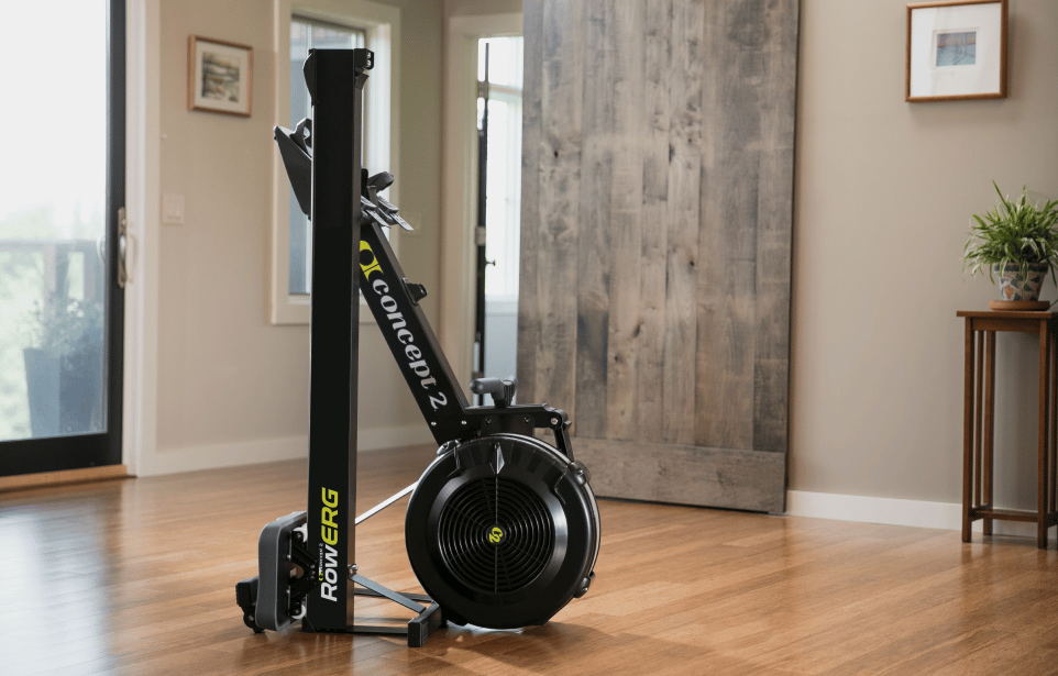 Concept2 RowErg rowing machine stored upright against a wall