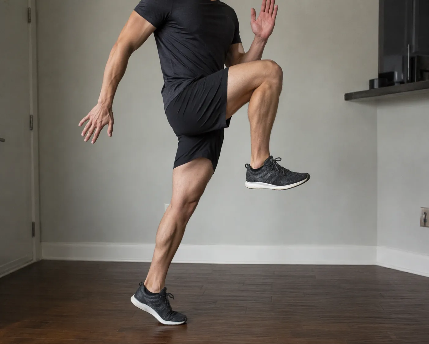 Close-up of a person performing an A-skip with knee lifted and foot dorsiflexed